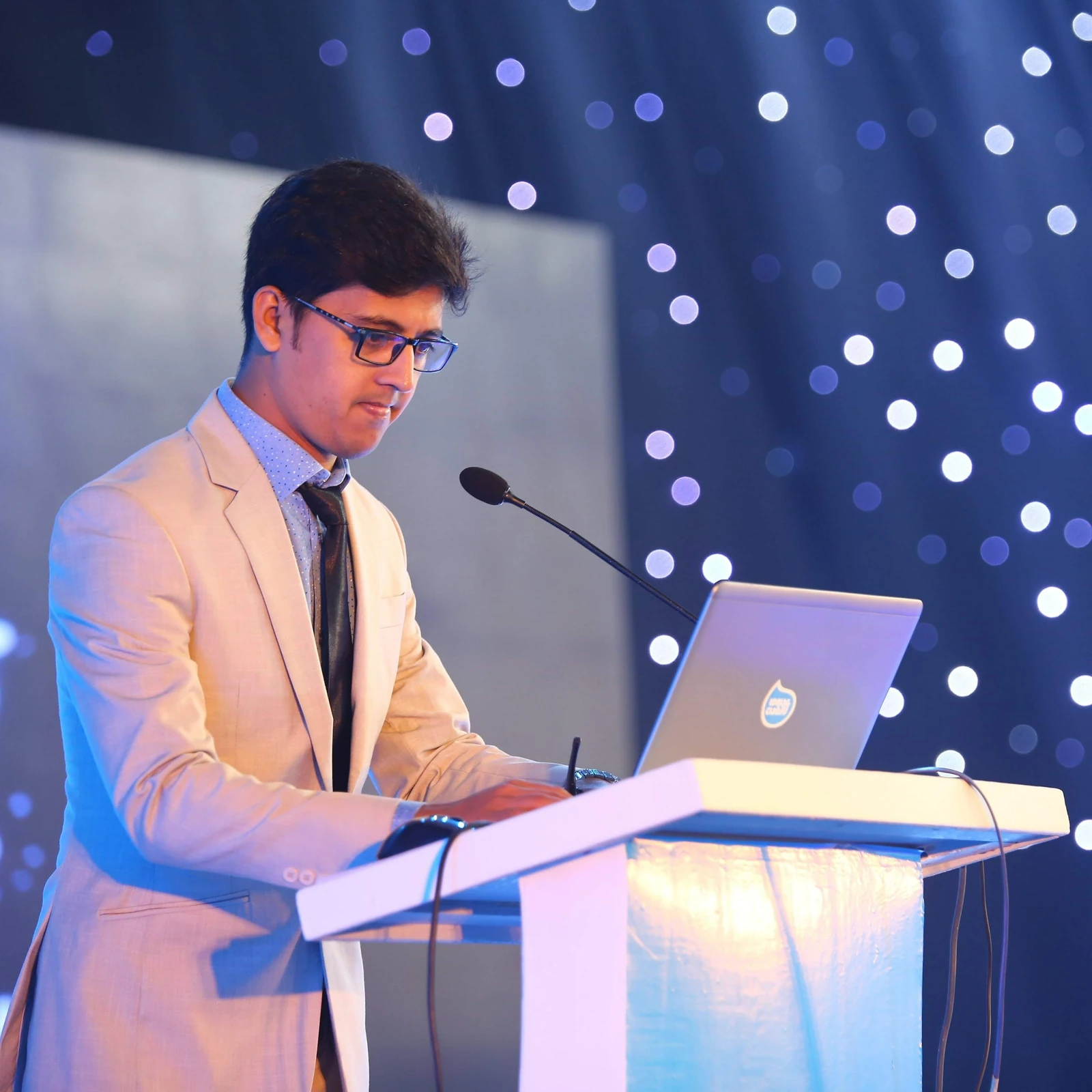 Presenting at an Aarong Dairy corporate event