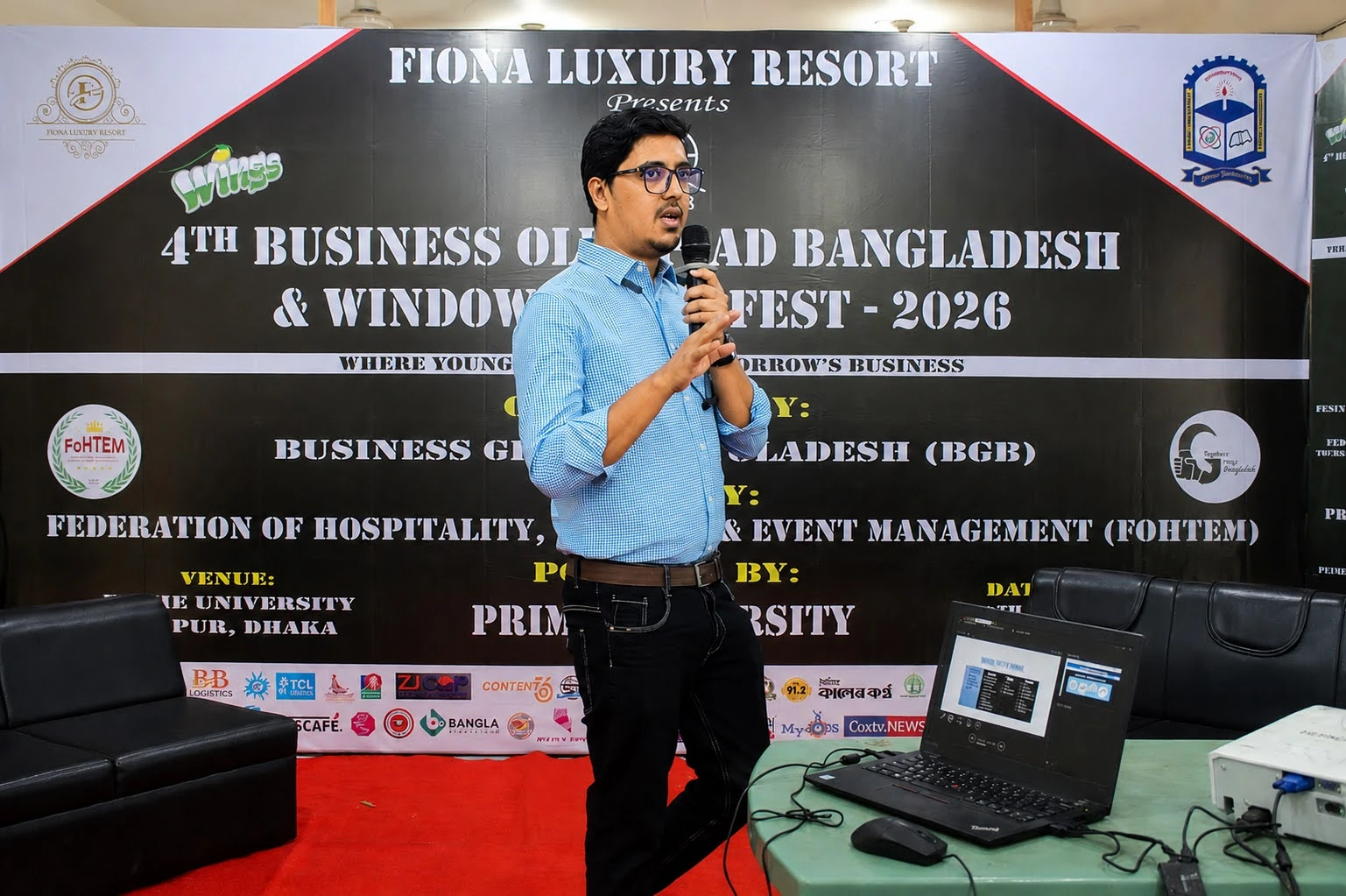 Nazmul Hasan speaking at the 4th Business Olympiad Bangladesh 2026
