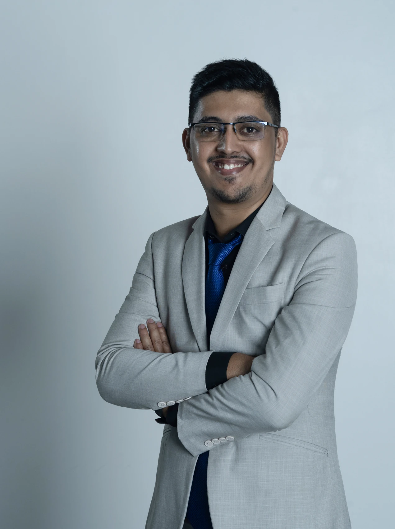 Md. Nazmul Hasan in a grey suit