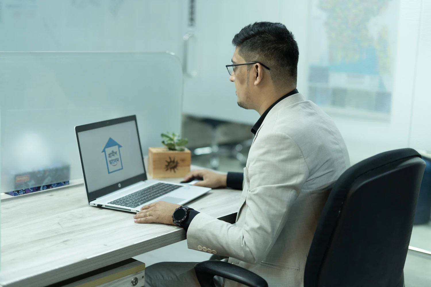 Nazmul Hasan at his Grameen Danone workstation